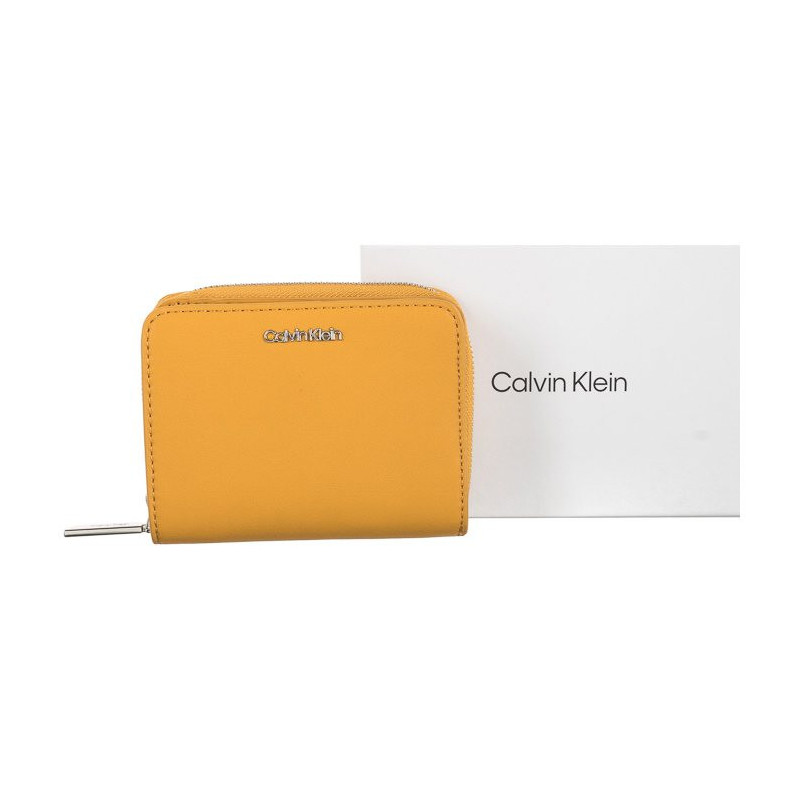 Calvin Klein CK Must Z/A Wallet W/Flap MD Monarch Gold K60K607432 KB7 (CK156-b) käekott